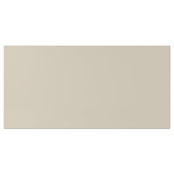 A rectangular, beige HAVSTORP kitchen cabinet with smooth, lacquered fiberboard surfaces, offering a modern, neutral design.