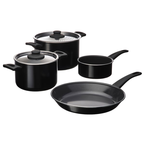 HEMLAGAD cookware in black. It includes pots and pans with non-stick surfaces and comfortable handles.