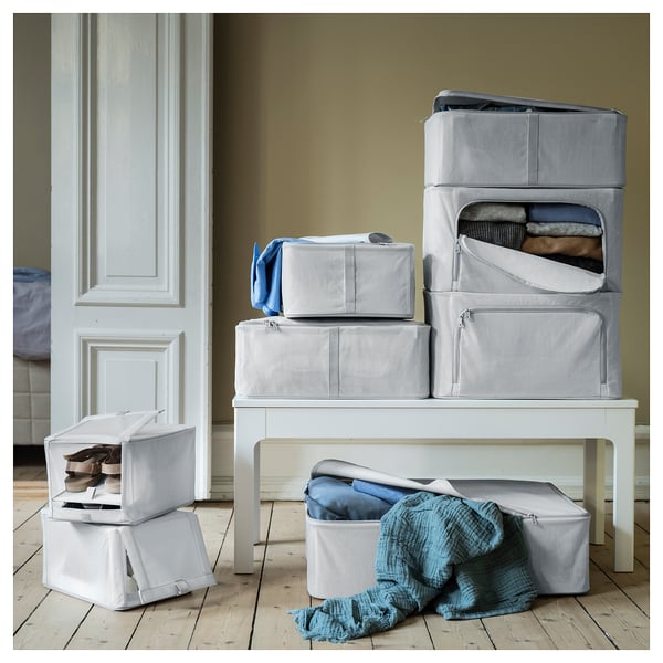 Set of grey fabric storage boxes; stackable with clear windows for visibility.