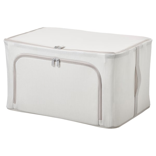 A HEMMAFIXARE storage box, cream-colored, with a sturdy frame, and multiple access zips, ideal for organising items in a closet.