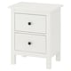 A white HEMNES wooden chest of drawers with two drawers, each having black knobs, standing on four legs.