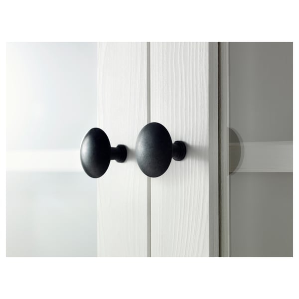 Black door knobs on white door