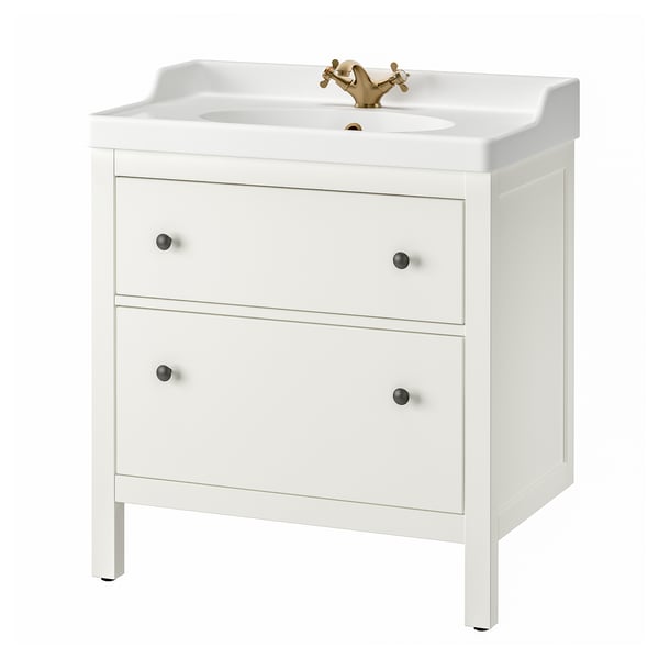 White HEMNES bathroom vanity; 2 drawers, gold tap, ceramic basin, wooden legs.