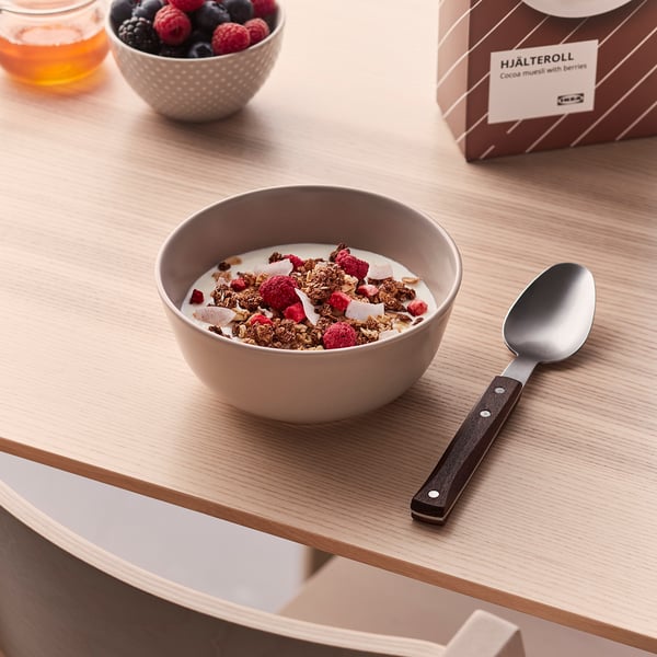 Yoghurt with granola and berries, spoon, cocoa muesli, mixed berries