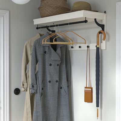 HÖSVANS bamboo hangers in natural color, elegantly shaped for shirts and blouses, fit neatly in closets.