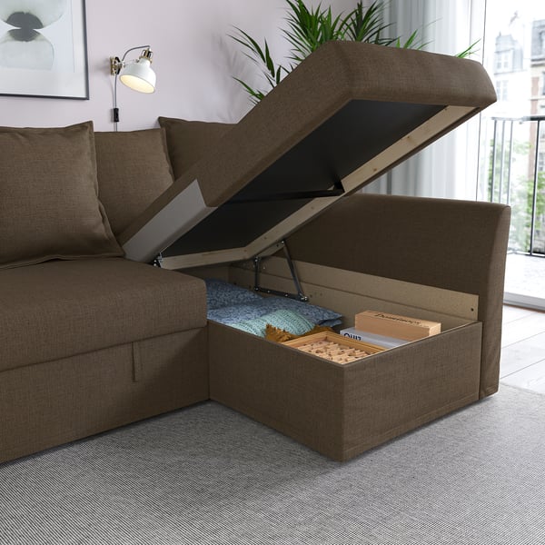 Sofa with storage: opened lid reveals blankets and books. Storage space under seat.