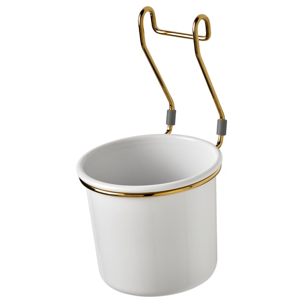 A white HULTARP kitchen utensil holder with a gold metal hook. Its designed to hang on rails or stand freely.