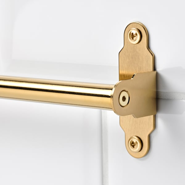 Gold metal rod securely fastened with screws, high-quality finish, attached to white surface.