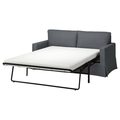Grey convertible sofa with white mattress, modern design.