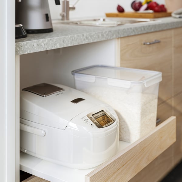 Kitchen drawer with rice cooker, plastic rice container, and leak-proof muesli jar by IKEA 365+.