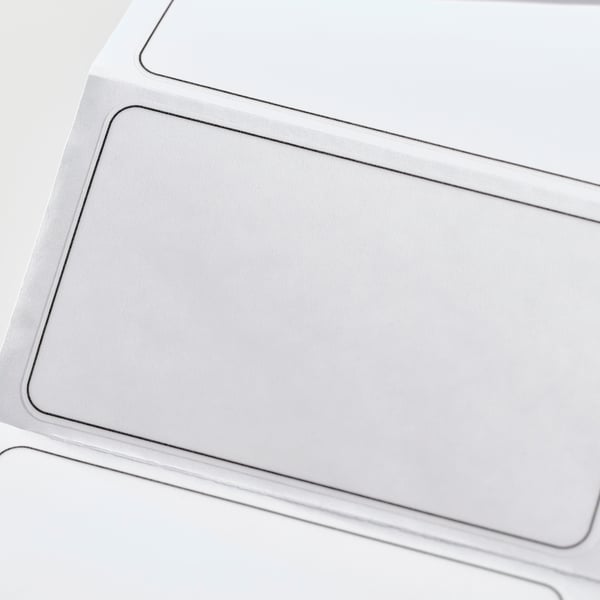 Clean, modern label. Smooth, white plastic surface. Crisp edges. Ideal for organising and gifting.