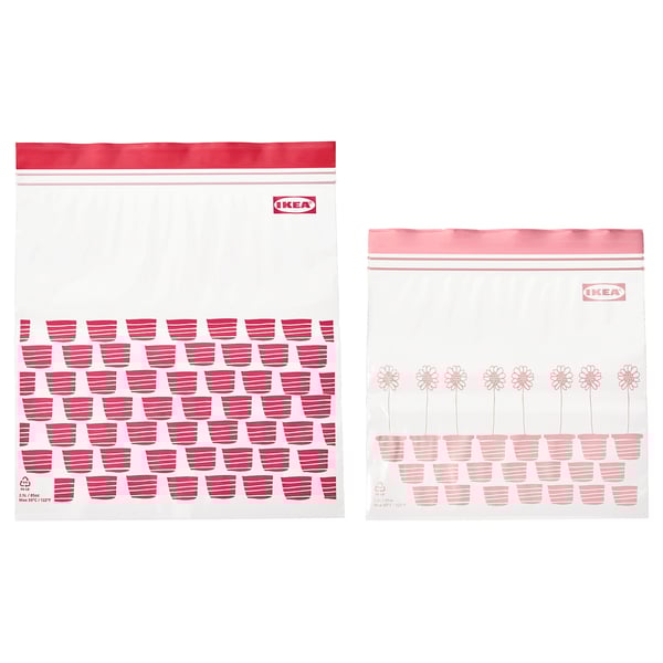 Two IKEA ISTAD resealable bags in red and light pink with flower and cup designs on transparent material.