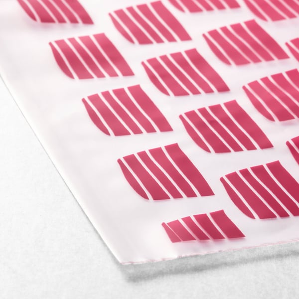 Multiple pink strips neatly arranged on a white surface. Ideal for organisation and reusable, showcasing precise and durable quality.