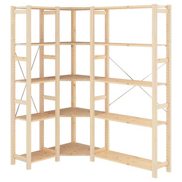 IVAR pine corner shelving unit. Light wood, six rectangular shelves, sturdy corner design.