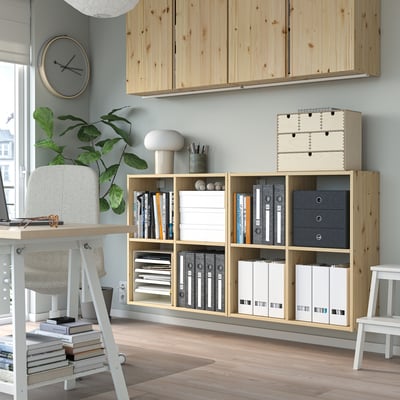 Home office with IVAR shelves and desk with laptop