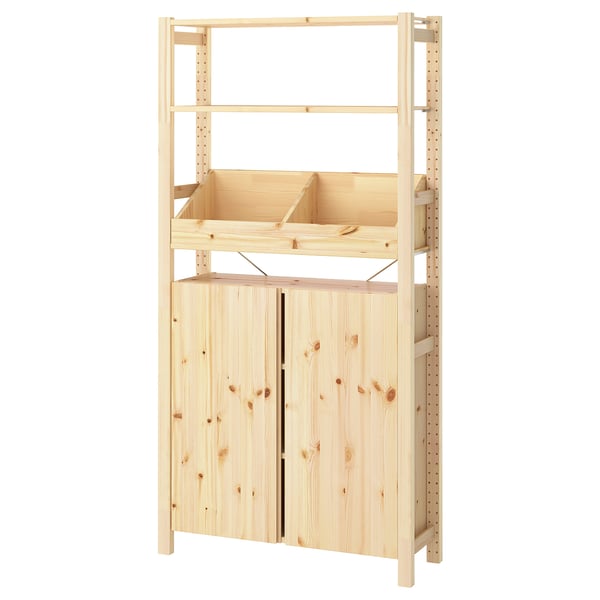 An IVAR light wood storage unit with adjustable shelves and cabinet doors.