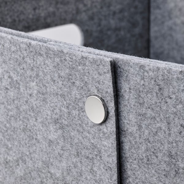 Box with metal button detail.