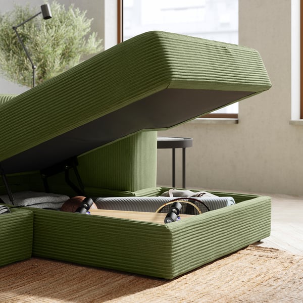 Modern olive-green modular sofa with storage, soft cushions, and clean lines.