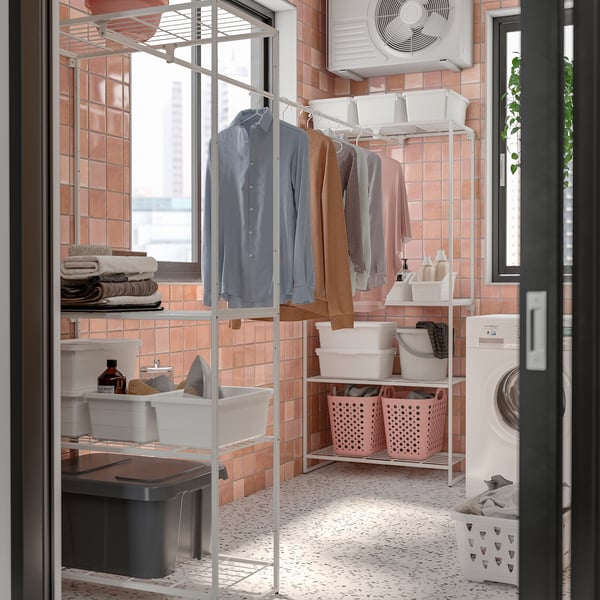 New JOSTEIN laundry organiser, white metal, hanging clothes, storage bins, washing machine, pink tiles.