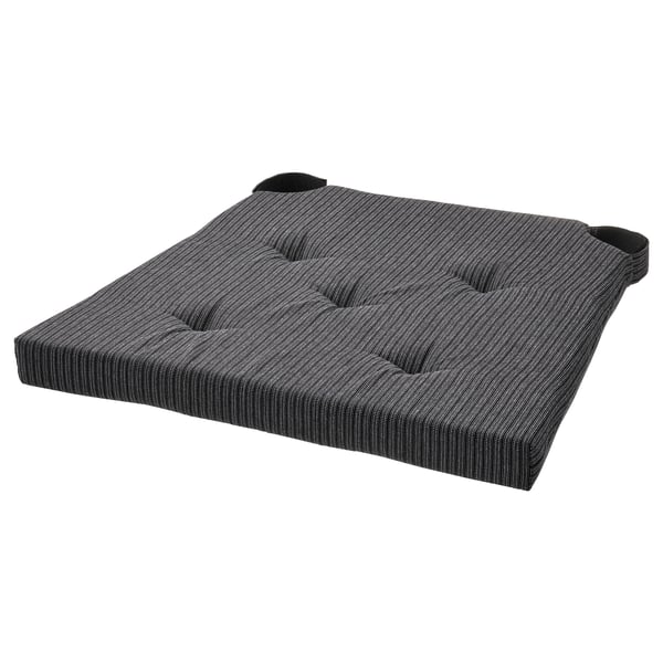 This image shows a JUSTINA chair pad, grey with white stripes, rectangular and padded, featuring two black straps for securing it in place.