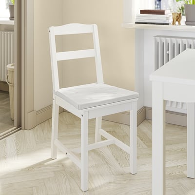 White wooden chair with cushion, simple and comfortable design.