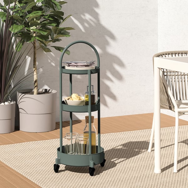 JUTTERSBO cart: three-tier, round, grey-green. Holds dishes, drinks, neat. Fits spaces beside chairs, near walls.
