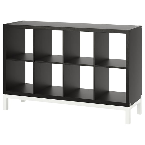 A black KALLAX shelving unit, featuring six cube compartments with a metal base, suitable for various room arrangements.