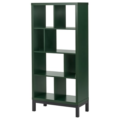 A green KALLAX shelving unit with multiple compartments, made from particleboard and steel, standing against a white background.