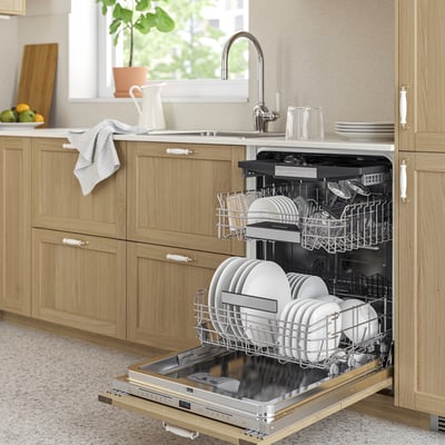 KALLBODA dishwasher open with clean dishes, stainless-steel design in modern kitchen.