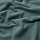 Thick, textured teal corduroy fabric, soft to touch, slightly lustrous.