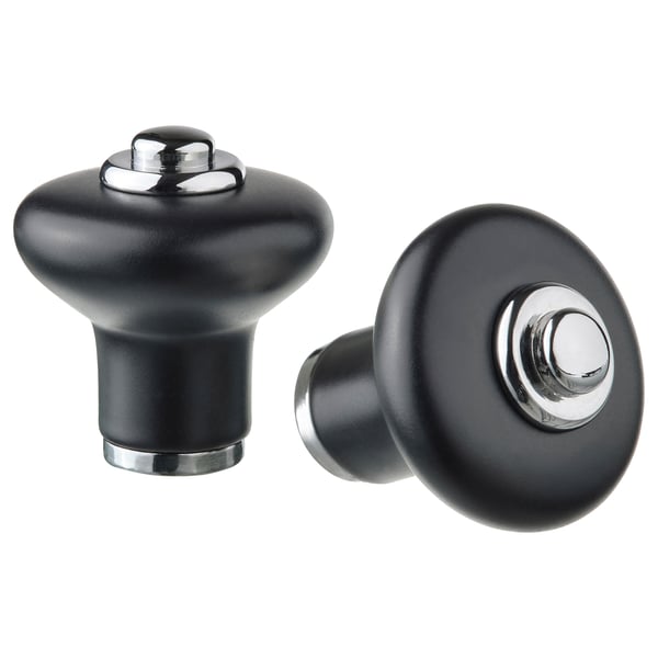 KLINGSTORP black knobs, matte porcelain-like finish, rounded shape with chrome accents.