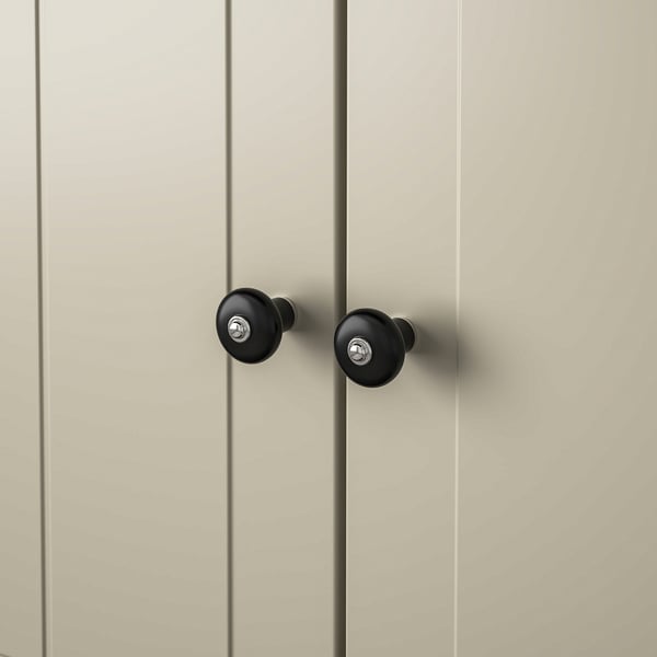 Black knobs on beige cabinet