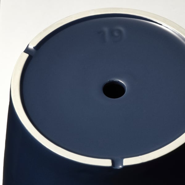 Blue stoneware saucer with drain hole