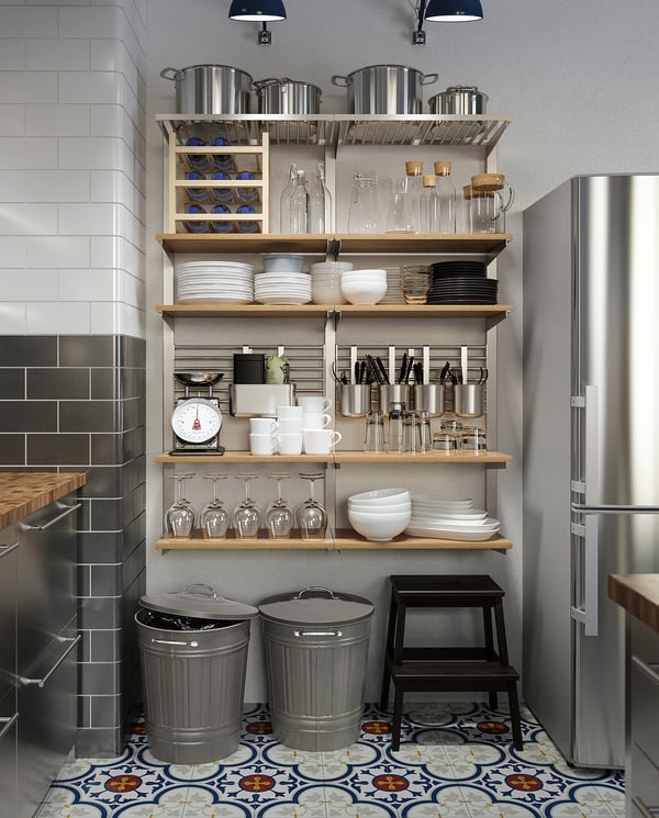 Organized kitchen with open shelves displaying dishes and KNODD bins.
