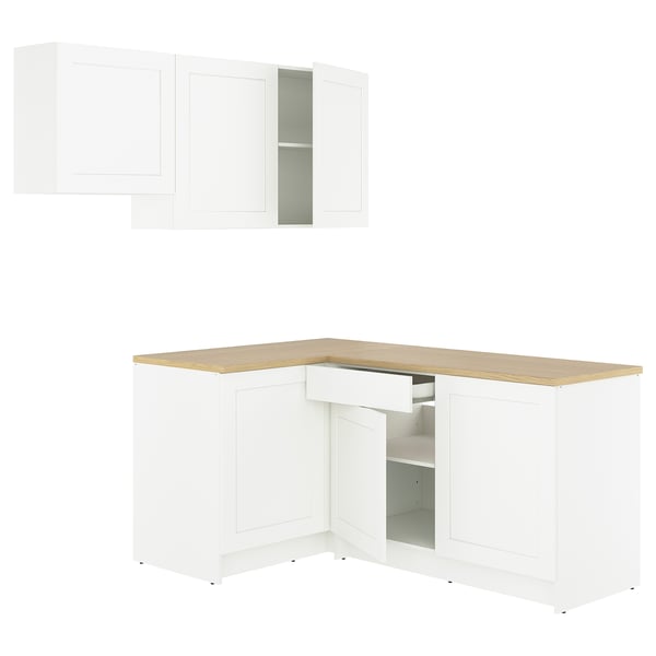 KNOXHULT l-shaped white kitchen with oak countertop, featuring cabinets and drawers for storage.