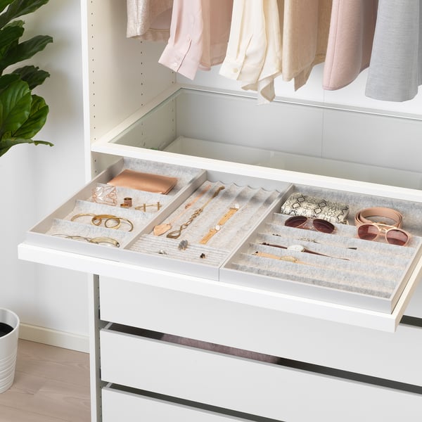 Open jewellery organiser with compartments for accessories, part of IKEAs KOMPLEMENT series.
