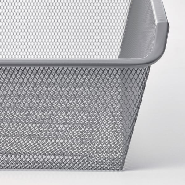 Silver mesh storage basket with diamond pattern, ideal for organising clothes and accessories.