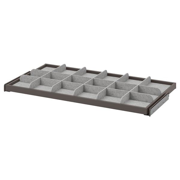 KOMPLEMENT grey organizer tray with multiple compartments for storing accessories and small items, made from durable materials.