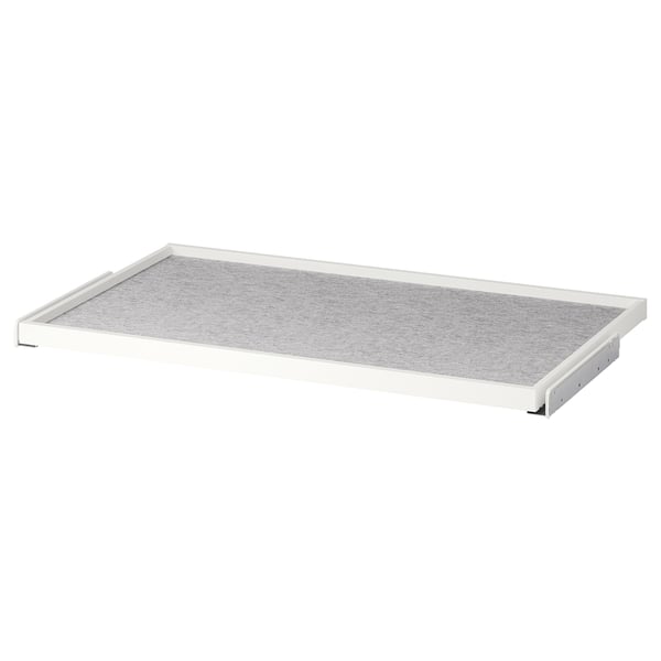 A white KOMPLEMENT pull-out tray with grey felt lining, designed for organizing wardrobe space.