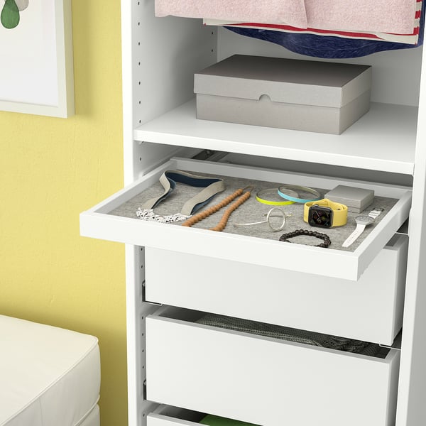 White wardrobe with pull-out tray showing jewellery organiser containing watches, bracelets, and other accessories.