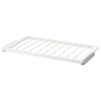 White KOMPLEMENT trouser hanger with grid design for organised storage.