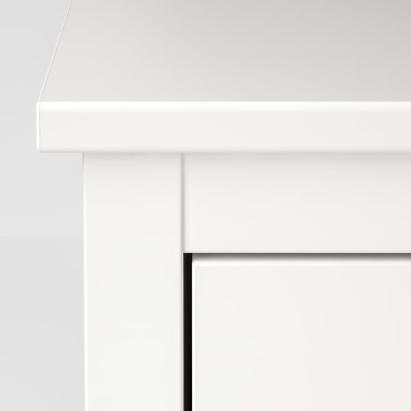 White chest of drawers, sleek design, sturdy build. Part of a secure furniture set.