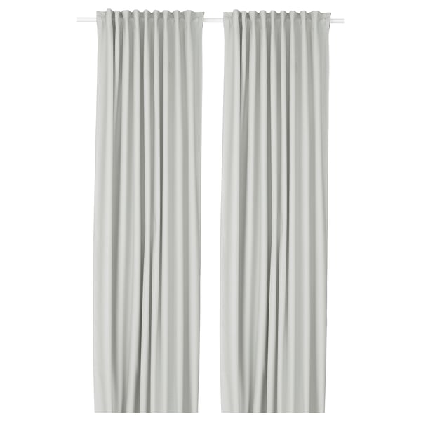 Two white floor-length block-out curtains with rod pockets, simple, elegant decor.