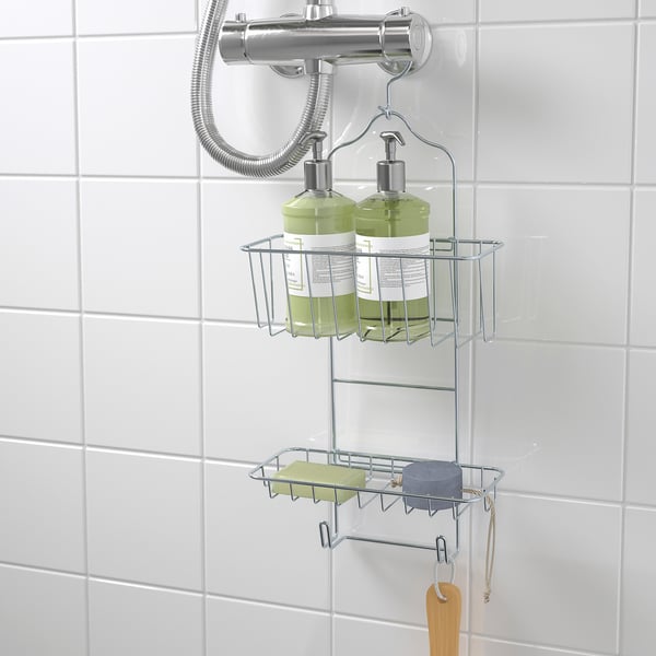 Metal shower caddy holds two green bottles, hangs on shower mixer, and includes two hooks.