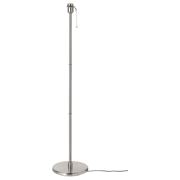 A KRYSSMAST floor lamp base in brushed nickel. Its tall, cylindrical, with a weighted base for stability. A pull chain switch is visible at the top.