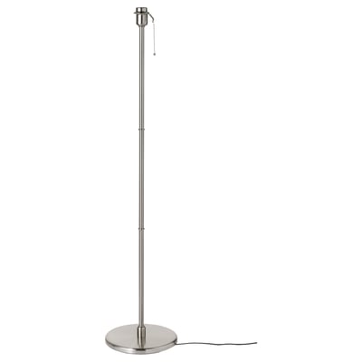 A KRYSSMAST floor lamp base in brushed nickel. Its tall, cylindrical, with a weighted base for stability. A pull chain switch is visible at the top.