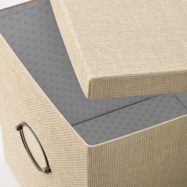 Open beige woven paper box with metal handle, inner grey patterned lining.