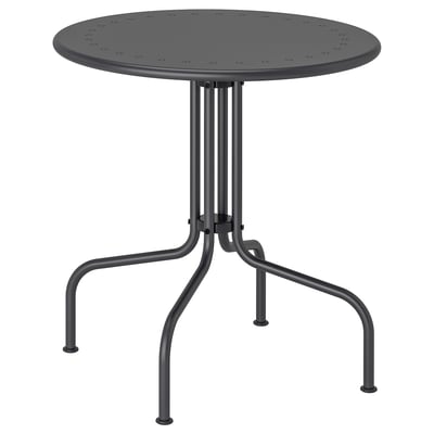 An LÄCKÖ round outdoor table; it is black, made of steel with a perforated top, and has a three-legged design.