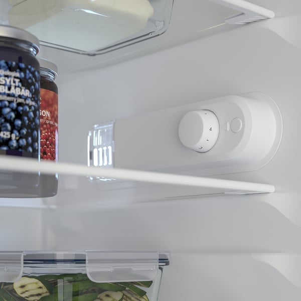 Fridge in cabinet with jam, fruit, temp control.