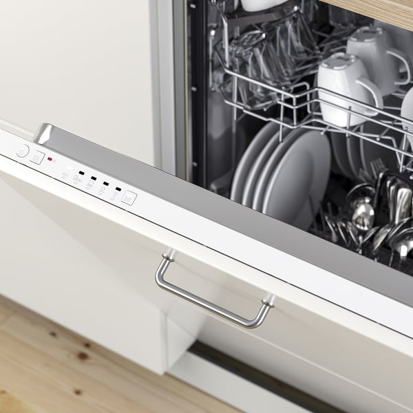 Open dishwasher filled with clean dishes. Control panel visible, highlighting built-in design and functional handle.